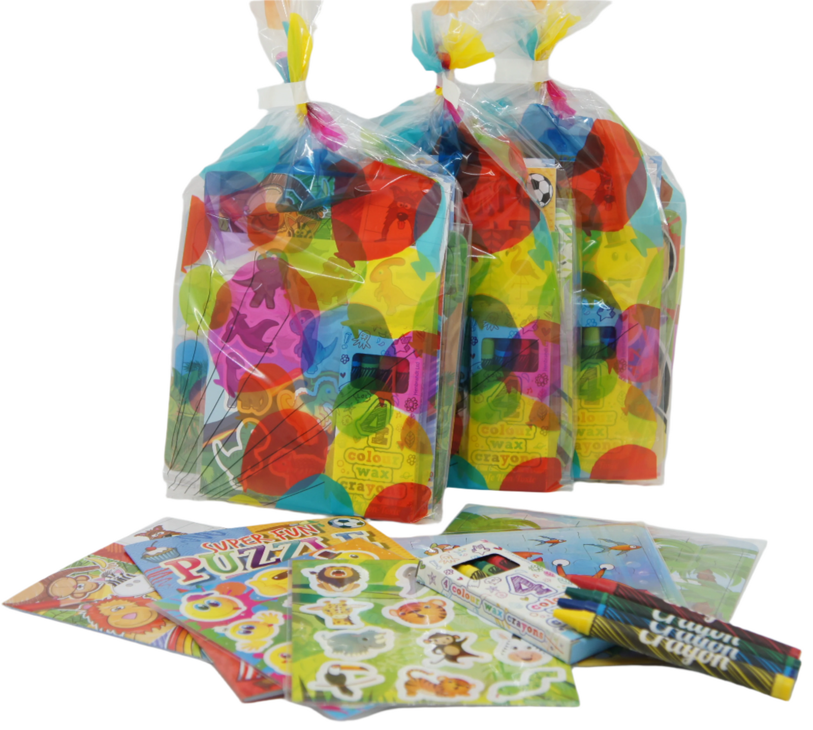 Colorful children's activity packs with puzzles and crayons on a white background